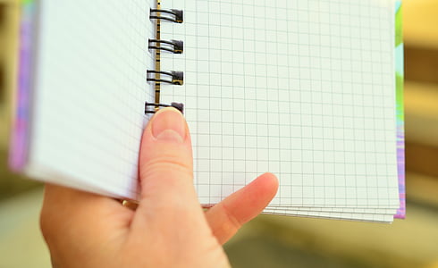 person holding spring notebook thumbnail