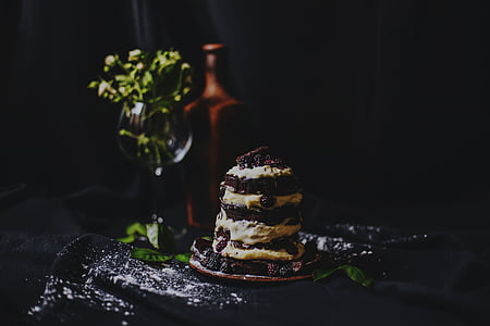 plate of cookies and cream cake placed beside green leafed plant thumbnail