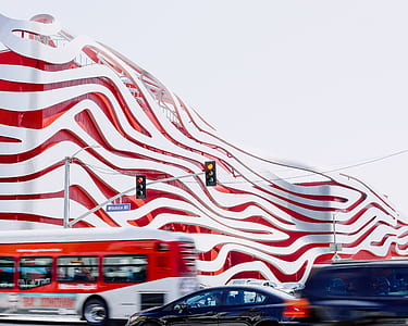 time lapse photo of red and white bus on the road thumbnail