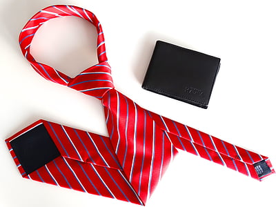 red, grey, and white striped necktie and black leather bi-fold wallet thumbnail