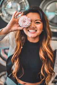woman holding donut thumbnail