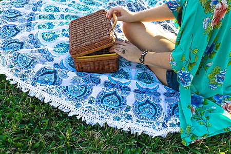 woman in front of basket sitting on mat thumbnail