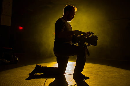 man holding professional video camera thumbnail