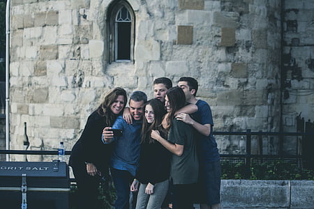 family taking photo together thumbnail