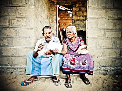 man and woman sitting by the door thumbnail