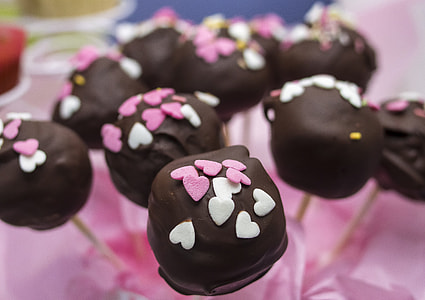 black chocolate with pink candies on top thumbnail