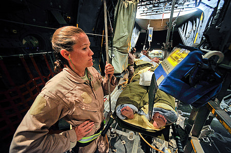 woman wearing brown officer's uniform thumbnail