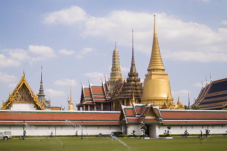 golden buildings under clouds thumbnail