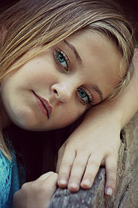 closeup photo of girl leaning on brown wooden surface thumbnail