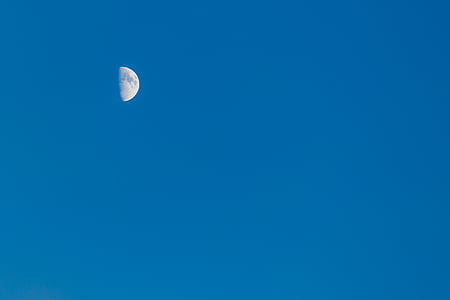 quarter moon on clear blue sky thumbnail