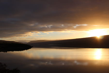 body of water underneath golden hour thumbnail