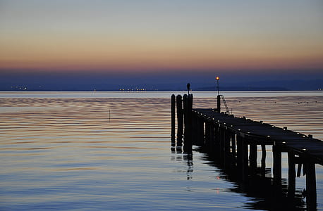 empty black dock during golden hour thumbnail
