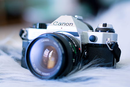 black and gray Canon DSLR camera thumbnail