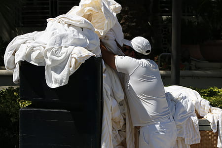 man holding clothes thumbnail