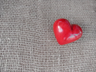 red heart ornament on brown textile thumbnail