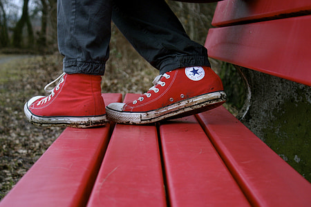 person wearing red Converse All-Star High-Tops thumbnail