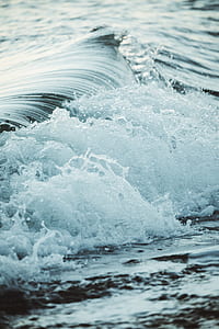 focus photography of sea wave thumbnail