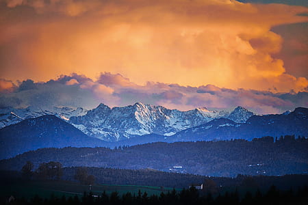 mountain under orange sky thumbnail