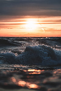 selective focus of wave during golden hour thumbnail