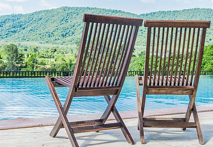 two brown wooden folding chairs thumbnail