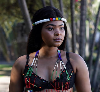 Photo of Woman Wearing Black Brassiere and Headdress thumbnail