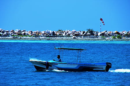 boat roaming on water during daytime thumbnail