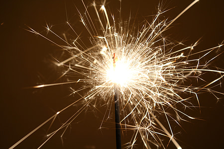 person lighting sparklers thumbnail