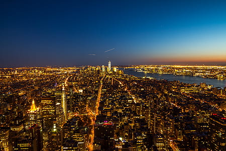 aerial photo of buildings at night thumbnail