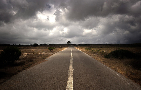 gray concrete road under sky thumbnail
