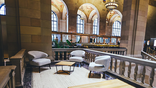 white padded armchairs at the terrace thumbnail