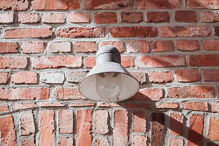 gray light scones on brown brick wall thumbnail