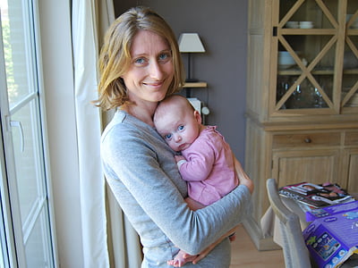 baby wearing pink footie thumbnail