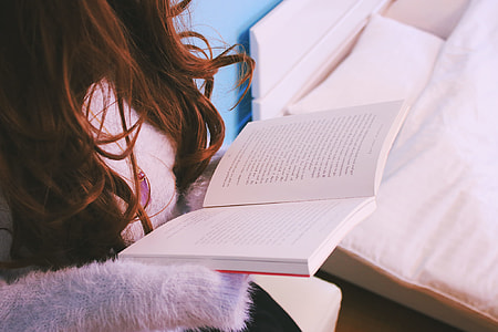 woman holding a book thumbnail
