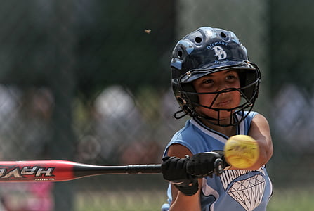 closeup photography of softball player during daytime thumbnail