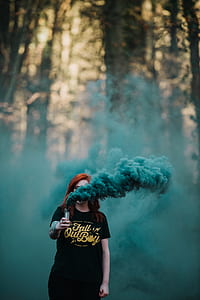 woman wearing black crew-neck with green smoke thumbnail