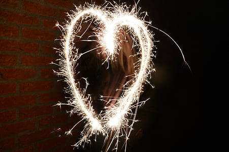yellow sparks forming heart thumbnail