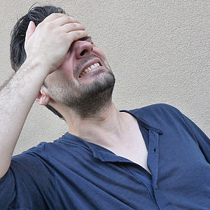 man covering his face with palm thumbnail