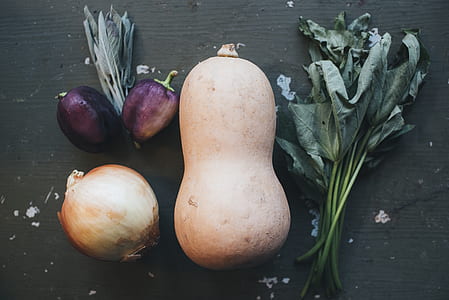 eggplant, onion, and raddish on table thumbnail