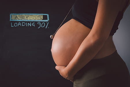 woman holding her tummy thumbnail