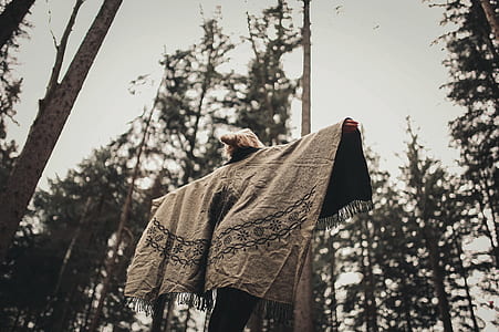 Person Spread Her Arms Wearing Gray Jacket thumbnail