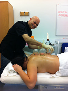 man performing ventosa cup massage thumbnail
