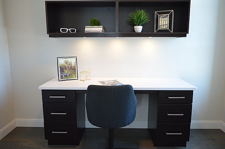 white and black wooden 6-drawer knee-hole desk with blue rolling chair thumbnail