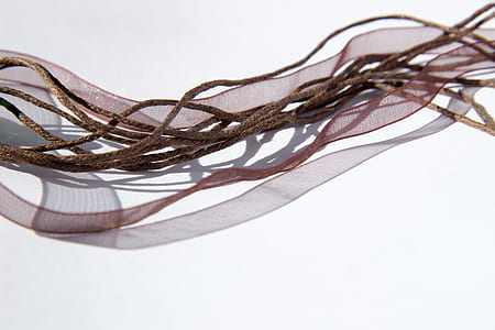 brown rope on white surface thumbnail