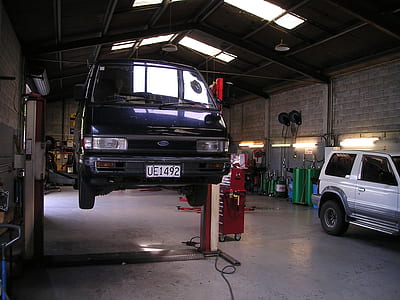 blue Kia Besta inside mechanic shop thumbnail