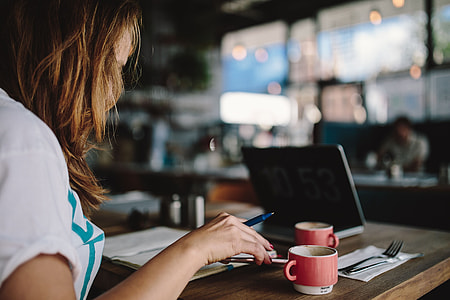 Young woman working in a cafe thumbnail