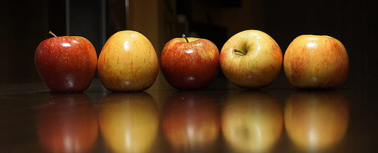 five red apples on surface thumbnail