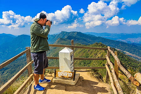 Photo of Man Taking Pictures thumbnail