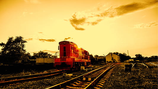 train near station during golden hour thumbnail