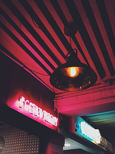 Round Brown Pendant Lamp on Red Ceiling Turned on thumbnail