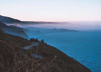 aerial photography of island covered with fog thumbnail
